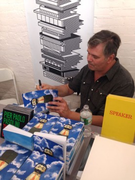 Rob Pruitt, signing copies of Rob Pruitt's eBay Flea Market: Year 1, published by bruno, 2015.