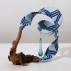 John Newman, Blue Ribbon Teardrop, 2008. Wood burl, blown glass, acrylic paint on acqua resin, wood putty, Japanese paper, papier mache, Foamcore, armature wire, string, 14-1/2 x 15-1/2 x 9 inches. The Louis-Dreyfus Family Collection