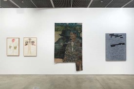 Works by, left to right, Nancy Spero, Leon Golub and Jenny Holzer installed at David Nolan Gallery in the exhibition under review