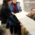A Book as a Bridge by Elena Berriola, performance, 2 Train from Wall Street to the Bronx, Monday, November 23, 2015. Photo: Sara Pettinella