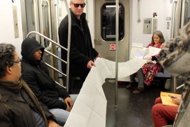 A Book as a Bridge by Elena Berriola, performance, 2 Train from Wall Street to the Bronx, Monday, November 23, 2015. Photo: Sara Pettinella