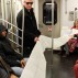 A Book as a Bridge by Elena Berriola, performance, 2 Train from Wall Street to the Bronx, Monday, November 23, 2015. Photo: Sara Pettinella