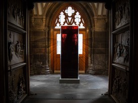 Jordan Eagles, Blood Mirror, 2015-present. 59 human blood donations preserved in UV resin, 84 x 28 x 28 inches. Installation view, Trinity Wall Street, New York. Photo: The Dusty Rebel