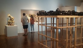 Installation shot of the exhibition under review showing Cheryl Ann Thomas, Spring, colored porcelain, 2015, left, and Kahlil Robert Irving, Protest: 1883 / United States vs. Harris, glazed stoneware, wood, 2018