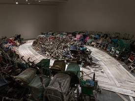 Nari Ward, Amazing Grace, 1993. Installation, found baby strollers and fire hoses. Image courtesy of the New Museum. Maris Hutchinson/EPW Studio