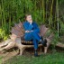 Claude Lalanne in 2018 seated on one of her crocodile benches. Photo: (c) Luc Castel