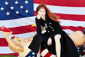 Roe Ethridge, Nathalie with Hot Dog and Flag, 2014. Dye sublimation print on aluminum, 47-5/8 x 71-5/8 inches. Courtesy of the artist and Andrew Kreps Gallery, New York.