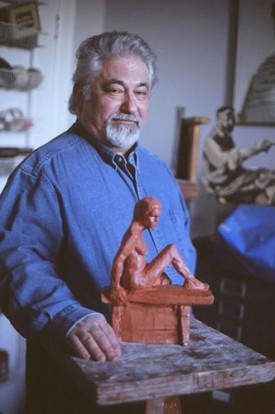 Marc Zimetbaum with one of his small figure sculptures
